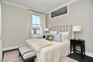 a bedroom with a large bed and a window at Kaiapoi Luxury Accommodation 1 - Bookahome in Kaiapoi