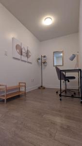 a room with a hair salon with a chair and a table at Lovely 2 Bed Condo in Downtown Toronto in Toronto