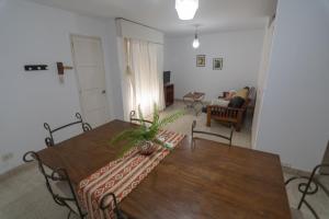 a living room with a table and a couch at Depto. Alvear 972 in San Salvador de Jujuy