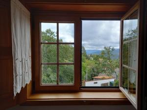 a window in a room with a view at O Bilhó in Vinhais