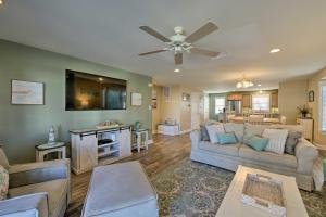 a living room with two couches and a ceiling fan at Wildwood Townhome with Patio 1 Block To The Beach! in Wildwood
