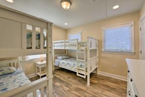 a bedroom with bunk beds in a house at Wildwood Townhome with Patio 1 Block To The Beach! in Wildwood