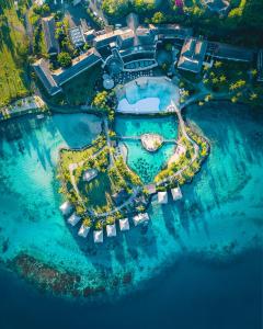 an aerial view of a resort in the water at InterContinental Tahiti Resort & Spa, an IHG Hotel in Faaa