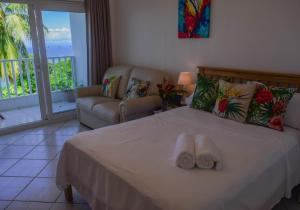 Katil atau katil-katil dalam bilik di Morne SeaView Apartments