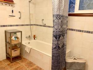 a bathroom with a bath tub and a shower at Stilvolle Villa in Teneriffa Süd in Arona
