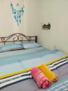 Ένα ή περισσότερα κρεβάτια σε δωμάτιο στο Dreamcatcher Homestay KK