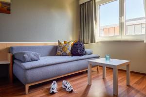 Posezení v ubytování ibis Hotel Würzburg City