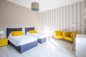 Posteľ alebo postele v izbe v ubytovaní Incantevole appartamento nel cuore di Bologna + 32 fotografií