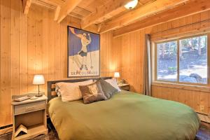 a bedroom with a large bed and a window at Alma Cloud 9 Cabin with Fireplace and Wooded Views! in Alma