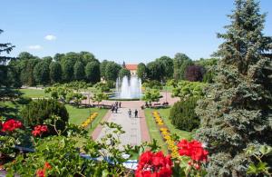 a view of a fountain in a park with flowers at Apartman Lavanda Banja Koviljaca in Banja Koviljača