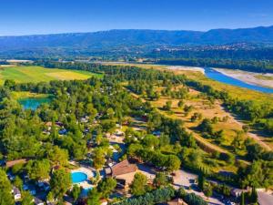 an aerial view of a resort with a river at PARADIS-ZEN in La Roque-dʼAnthéron