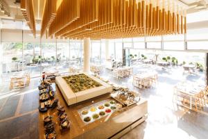 a restaurant with a buffet of donuts on a table at Sono Felice Village Vivaldi Park in Hongcheon