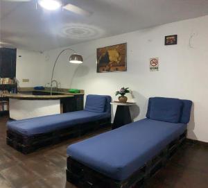 Un ou plusieurs lits dans un hébergement de l'établissement Hostal Loco Coco Loco