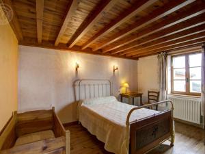 a bedroom with a bed and a wooden ceiling at Gîte Saint-Bonnet-le-Courreau, 5 pièces, 6 personnes - FR-1-496-9 in Saint-Bonnet-le-Courreau