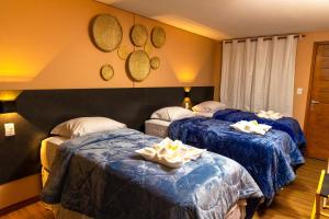 Кровать или кровати в номере Pousada Flor de Noronha
