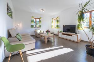 Televízia a/alebo spoločenská miestnosť v ubytovaní Apartment Flandria