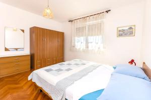 Postel nebo postele na pokoji v ubytování Apartments Jerko