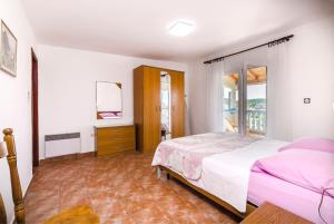 Postel nebo postele na pokoji v ubytování Apartments Jerko