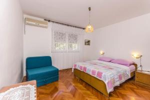 Postel nebo postele na pokoji v ubytování Apartments Jerko