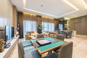 a living room with a ping pong table at Starlight Penthouse 6-12Pax, 600m to Pavilion KL by Verano in Kuala Lumpur