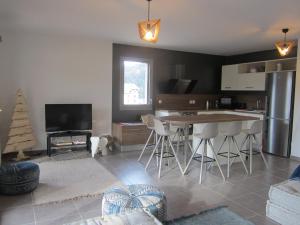 a kitchen and living room with a christmas tree in it at Appartement Villard-de-Lans, 3 pièces, 6 personnes - FR-1-689-14 in Villard-de-Lans