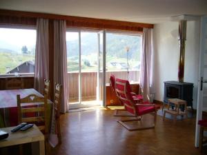 a bedroom with a room with a bed and a room with a fireplace at Appartement Villard-de-Lans, 4 pièces, 10 personnes - FR-1-689-36 in Villard-de-Lans