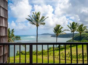 a view of the ocean from the balcony of a resort at Sealodge E6 in Princeville