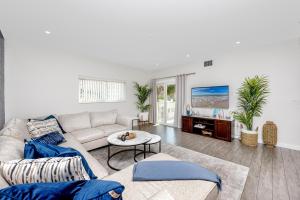 a living room with a couch and a table at #1 Stunning Ocean View completely remodeled luxury condo with huge balcony in Clearwater Beach
