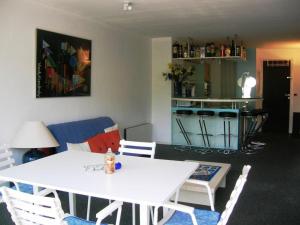 a living room with a white table and chairs at Appartement Villard-de-Lans, 2 pièces, 4 personnes - FR-1-689-94 in Villard-de-Lans