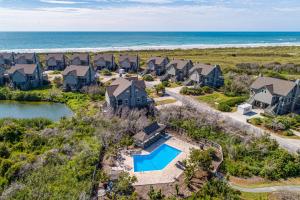 an aerial view of a row of houses and the ocean at Park Topsail Beach in Topsail Beach