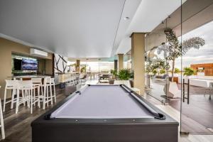 a pool table in a room with a bar at Skyloftpv by LOFT268 in Puerto Vallarta