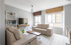 a living room with a couch and two chairs and a tv at 3 Bedroom Beautiful Apartment In Viveiro in Viveiro