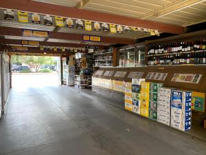 a grocery store aisle with a lot of products on display at Black Lion Inn Hotel in Broken Hill