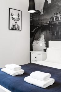 Posteľ alebo postele v izbe v ubytovaní Househost Apartment: Bonerowska 5/19