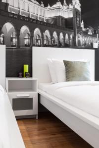 Posteľ alebo postele v izbe v ubytovaní Househost Apartment: Bonerowska 5/19