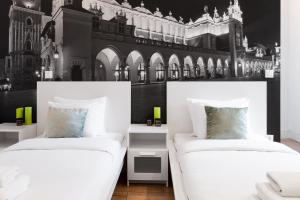 Posteľ alebo postele v izbe v ubytovaní Househost Apartment: Bonerowska 5/19