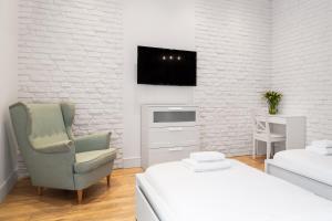 Posteľ alebo postele v izbe v ubytovaní Househost Apartment: Bonerowska 5/19