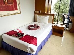 Postel nebo postele na pokoji v ubytování Lamai Guesthouse