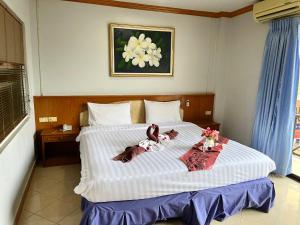 Postel nebo postele na pokoji v ubytování Lamai Guesthouse