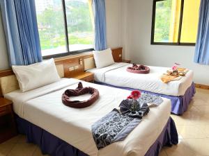 Кровать или кровати в номере Lamai Guesthouse