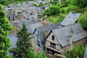 an aerial view of a town with houses and roofs at La maison d'hôtes Ty Pic in La Vicomté-sur-Rance
