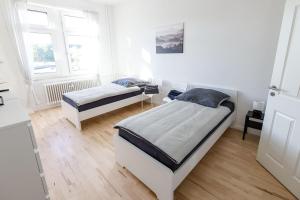 Postel nebo postele na pokoji v ubytování Modern & Chic Apartment with Balcony in Offenbach