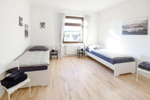 Postel nebo postele na pokoji v ubytování Modern & Chic Apartment with Balcony in Offenbach