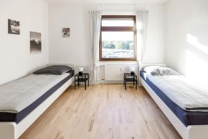 Postel nebo postele na pokoji v ubytování Modern & Chic Apartment with Balcony in Offenbach