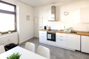 Kuchyň nebo kuchyňský kout v ubytování Modern & Chic Apartment with Balcony in Offenbach