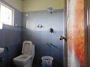 Koupelna v ubytování Cauvery Homestay