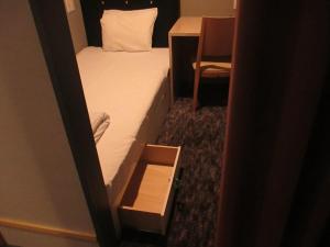 เตียงในห้องที่ Hotel M Matsumoto