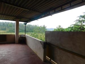 Balkón nebo terasa v ubytování Cauvery Homestay