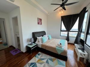 Postel nebo postele na pokoji v ubytování D'Gunduls Homestay Family Suite 2R 2B by DGH I-CITY