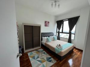 Postel nebo postele na pokoji v ubytování D'Gunduls Homestay Family Suite 2R 2B by DGH I-CITY